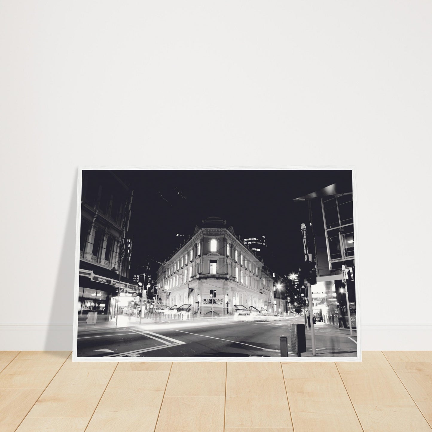 Monochrome artwork of Wellington’s Old Bank Arcade lit up at night, with glowing windows and a classic architectural facade.