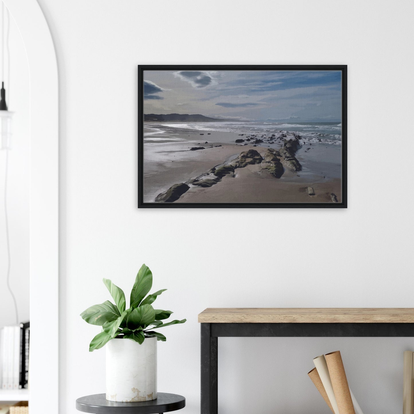 A moody, windswept beach and a line of sea-weathered rocks stretching into the distance, this artwork captures the raw, untouched feel of a wild shoreline.