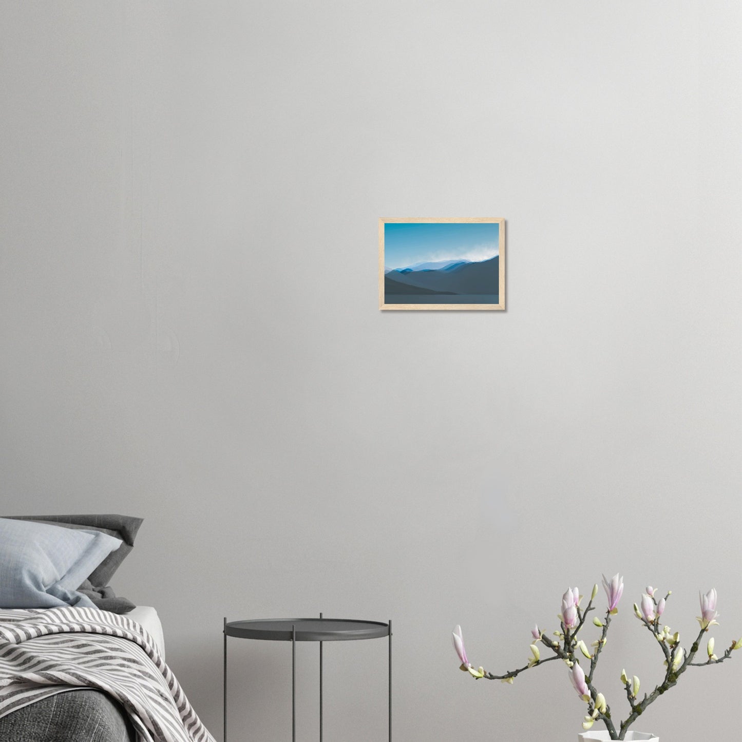 Layered blue mountain ridges fading into mist under a soft sky, evoking calm and simplicity.