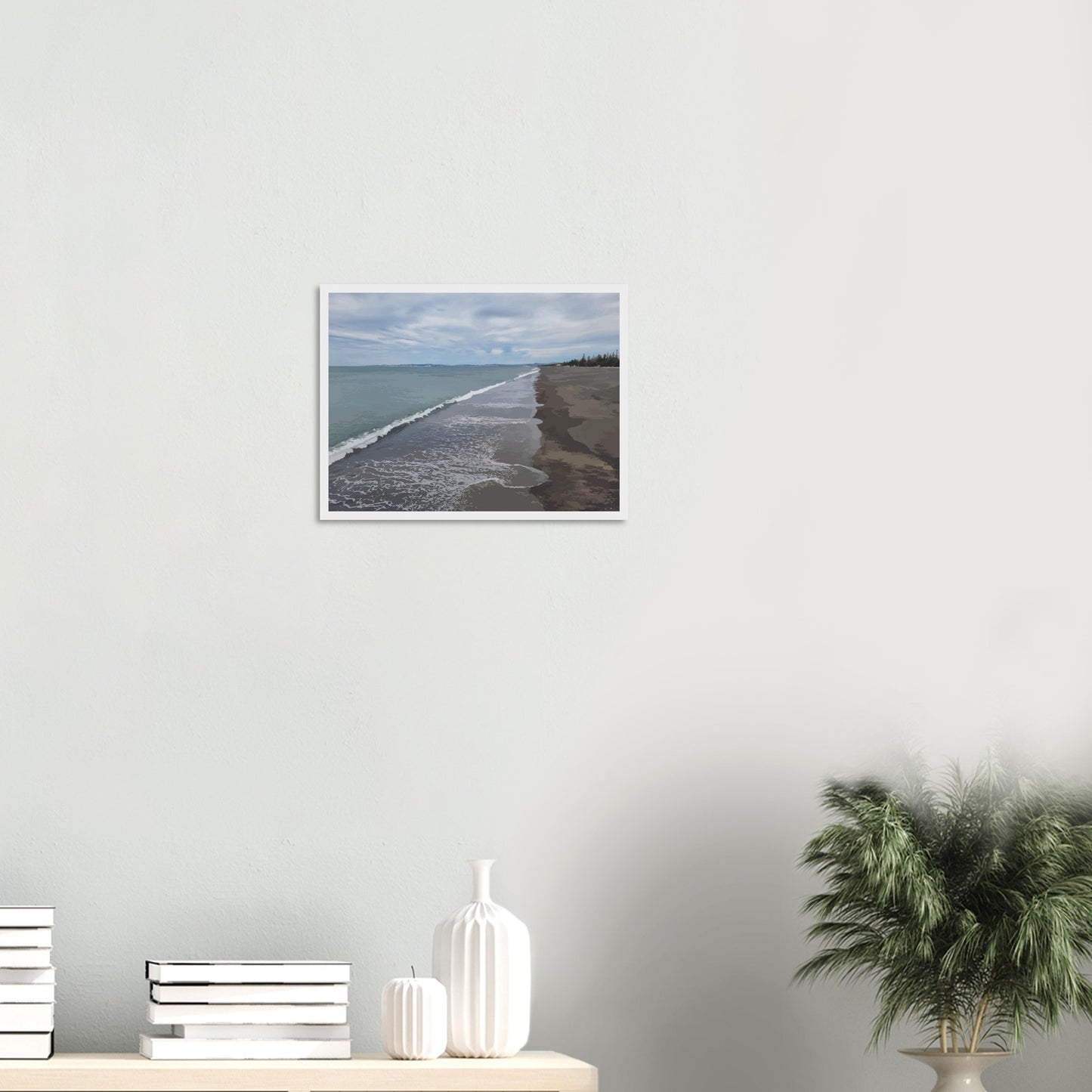 Gentle waves roll onto the dark sand, stretching endlessly into the distance under a softly clouded sky. Hints of pine trees and distant land complete the scene