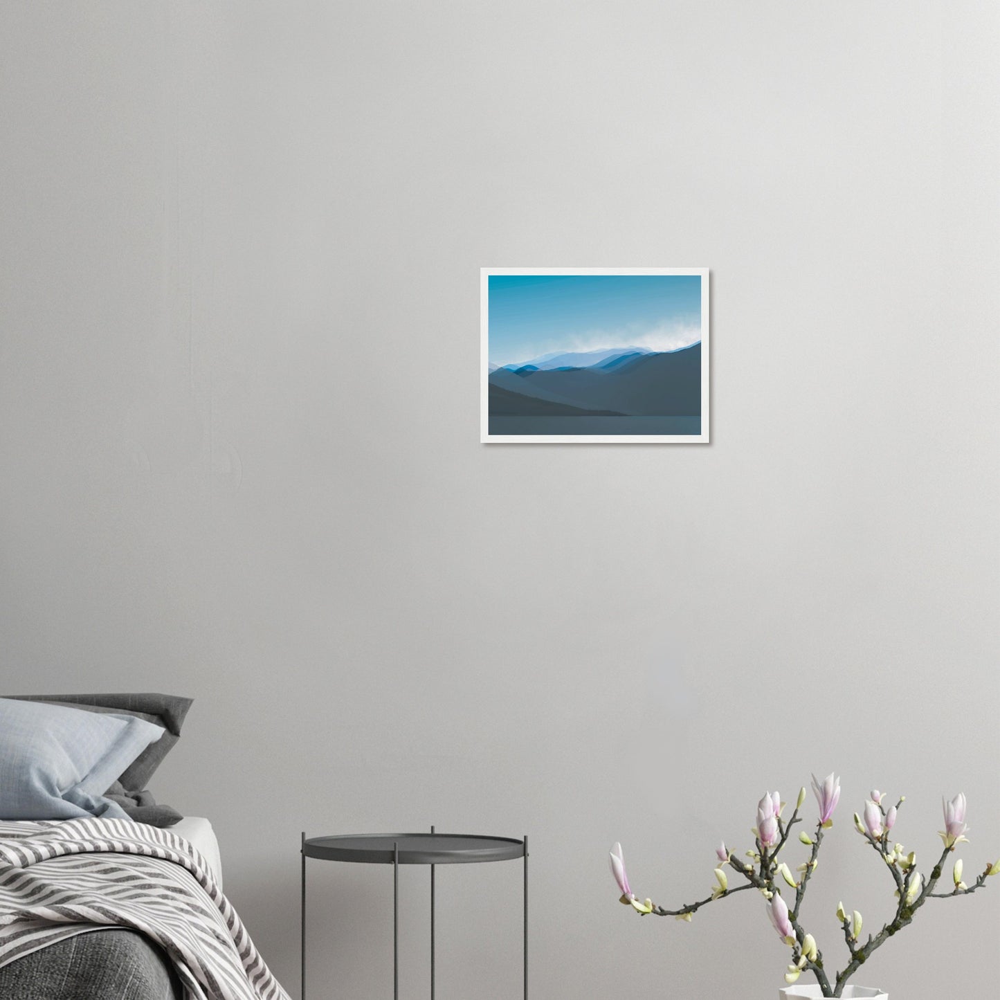 Layered blue mountain ridges fading into mist under a soft sky, evoking calm and simplicity.