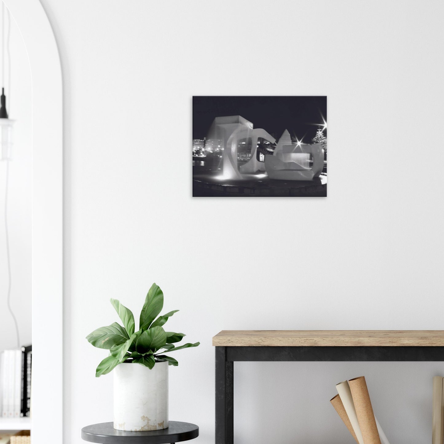 Monochrome artwork of Wellington’s Albatross Fountain lit at night, featuring bold sculptural lines and soft lighting.