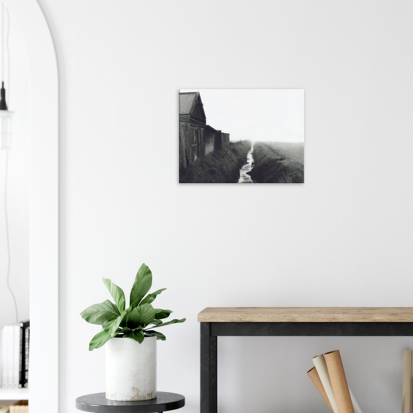Moody artwork of a rustic barn and misty stream in rural New Zealand, evoking stillness and foggy morning light.