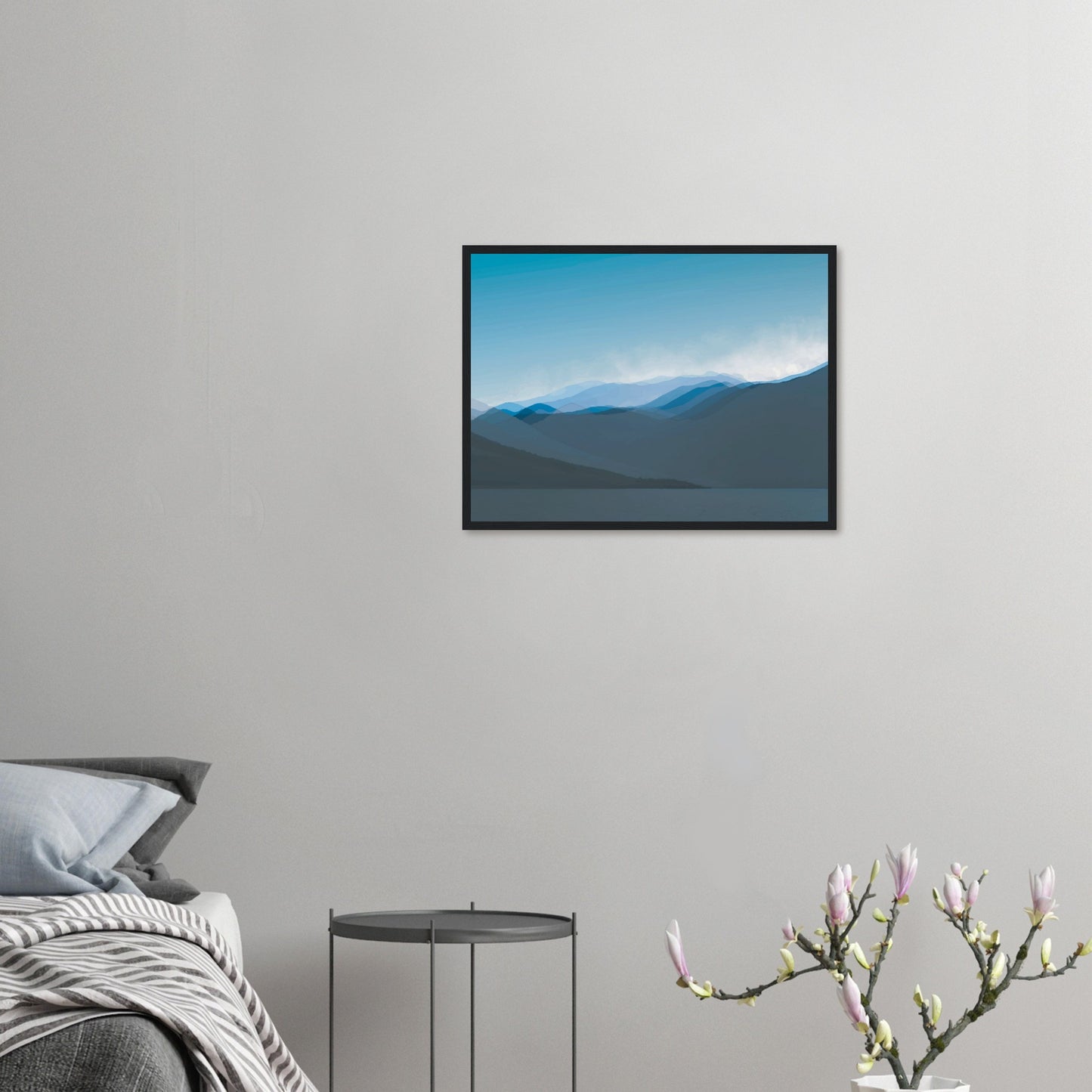 Layered blue mountain ridges fading into mist under a soft sky, evoking calm and simplicity.