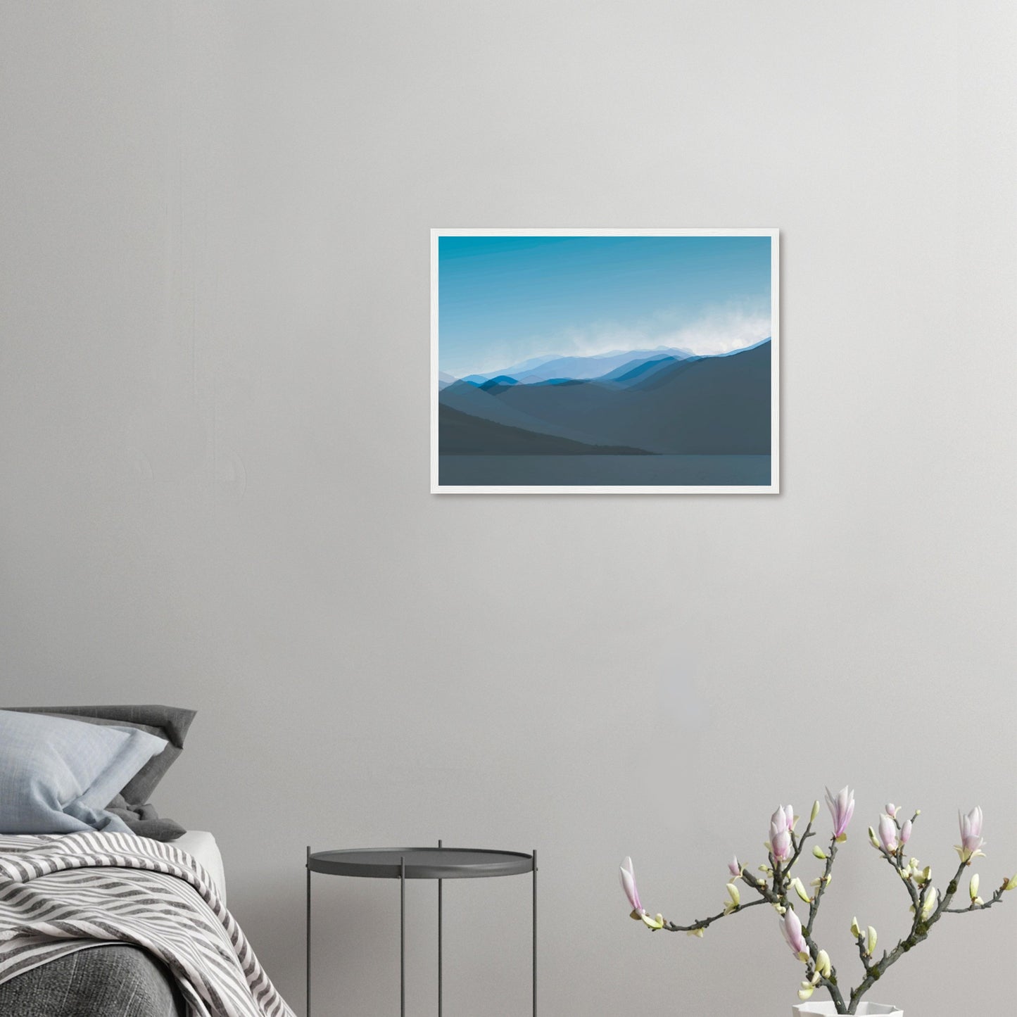 Layered blue mountain ridges fading into mist under a soft sky, evoking calm and simplicity.
