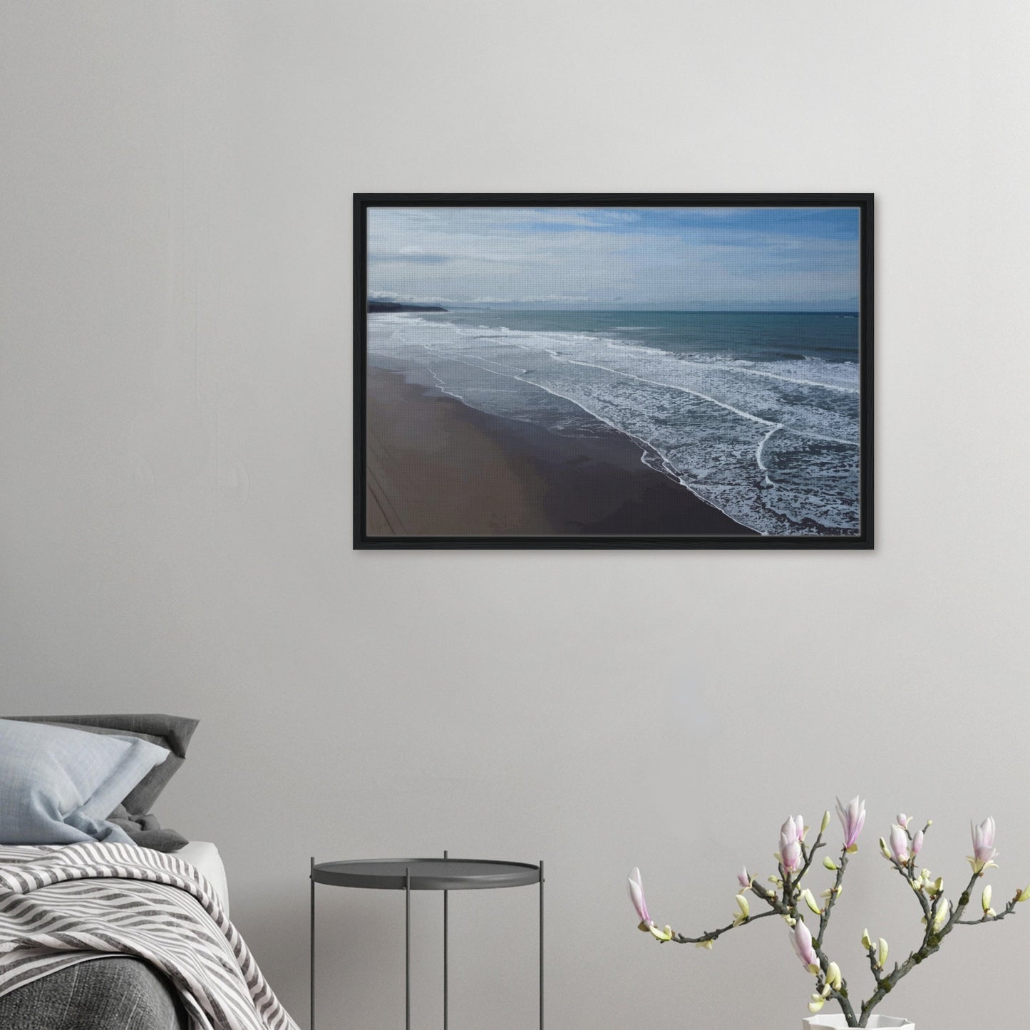 Soft, muted tones of sand, seafoam, and sky blend together in a calming composition, highlighting the natural rhythm of waves lapping the shore.