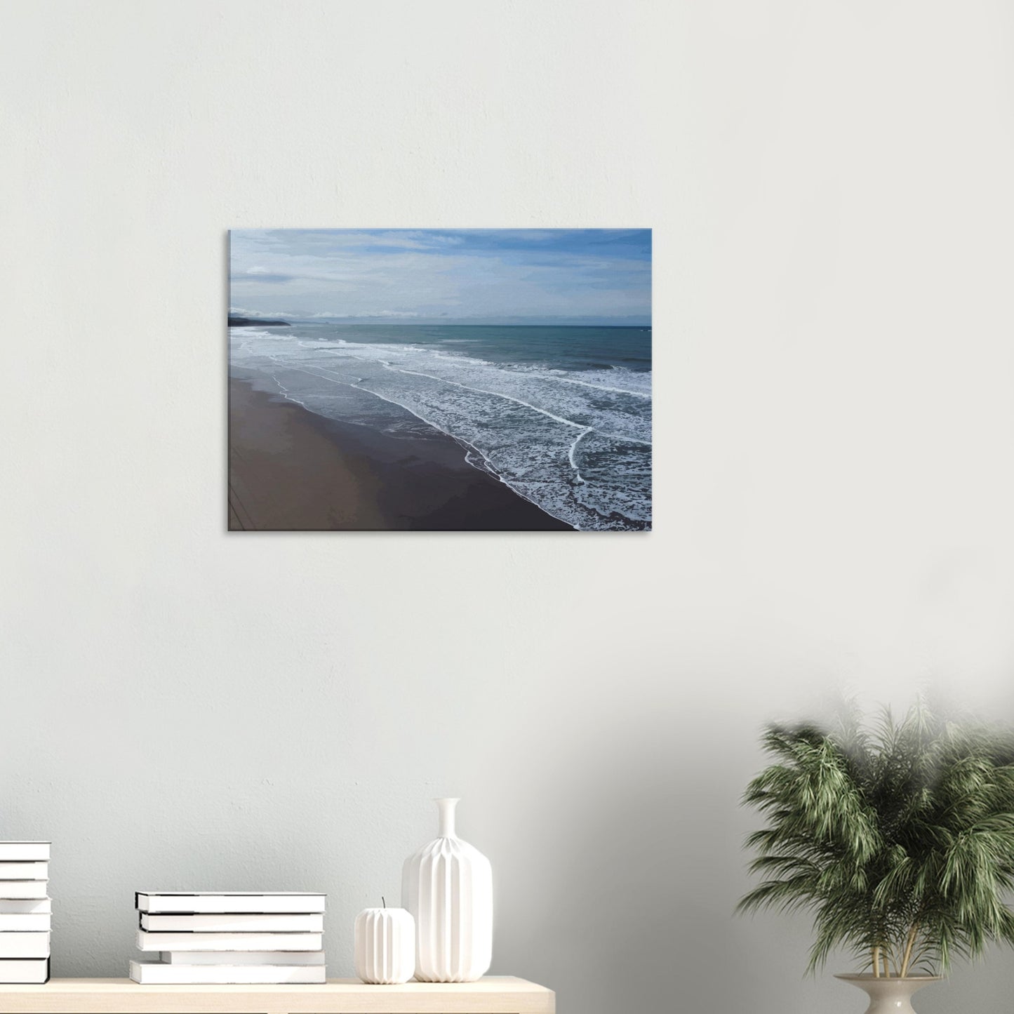 Soft, muted tones of sand, seafoam, and sky blend together in a calming composition, highlighting the natural rhythm of waves lapping the shore.