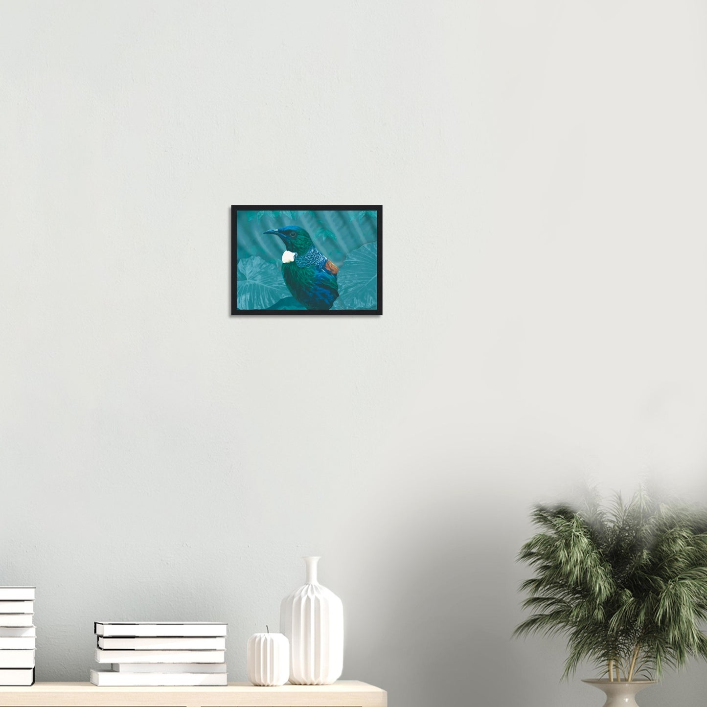 With rich teal and emerald hues and the tūī’s signature white throat tufts, the artwork evokes the dappled light of the forest and the bird’s melodic presence among the trees.
