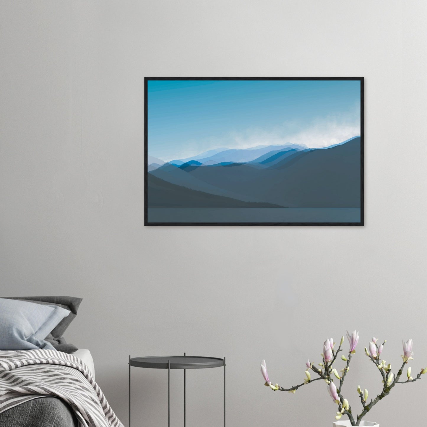 Layered blue mountain ridges fading into mist under a soft sky, evoking calm and simplicity.
