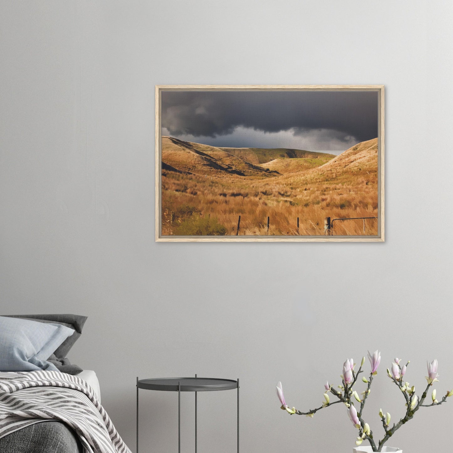 Golden Hawke’s Bay hills beneath dark clouds in a nostalgic NZ landscape artwork titled Trip Home by Ben Hart.