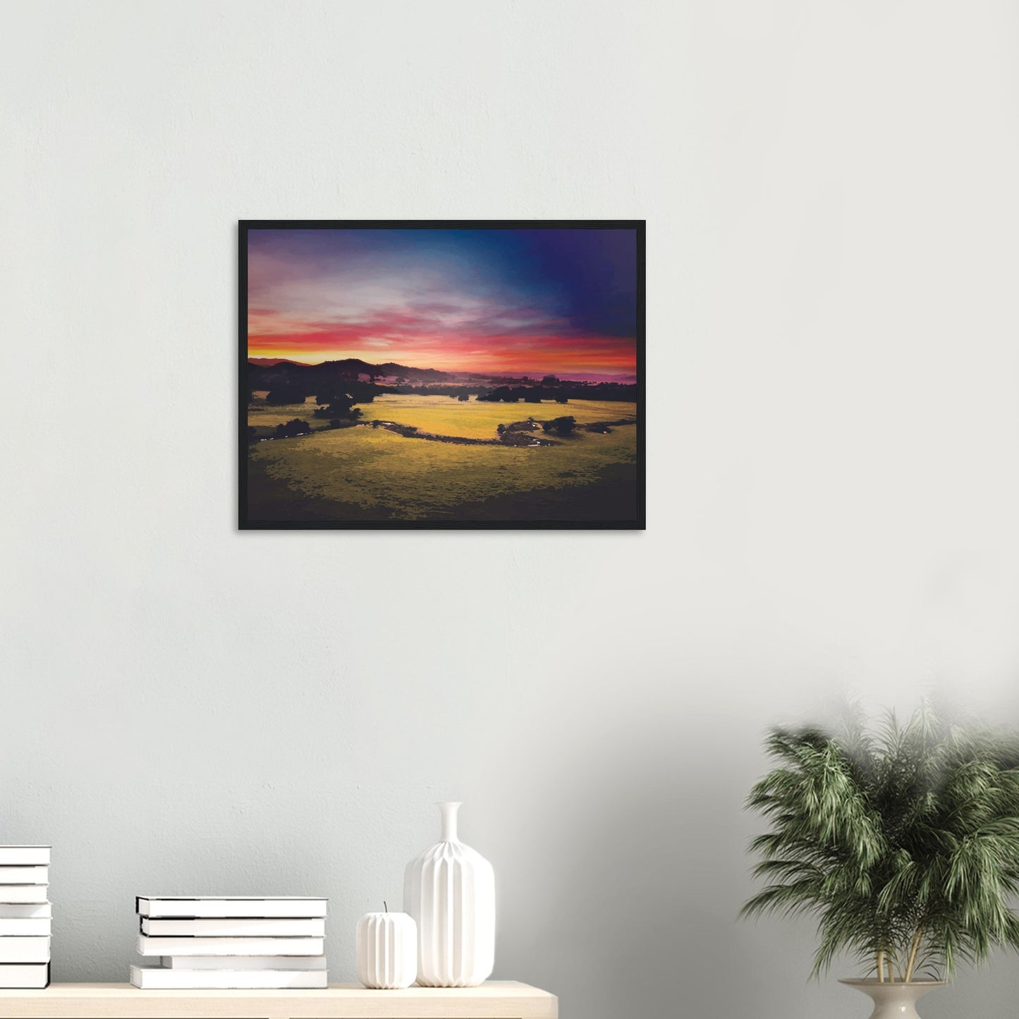 Sunrise over green fields and hills in Wairarapa, with glowing skies in purple, orange, and pink.