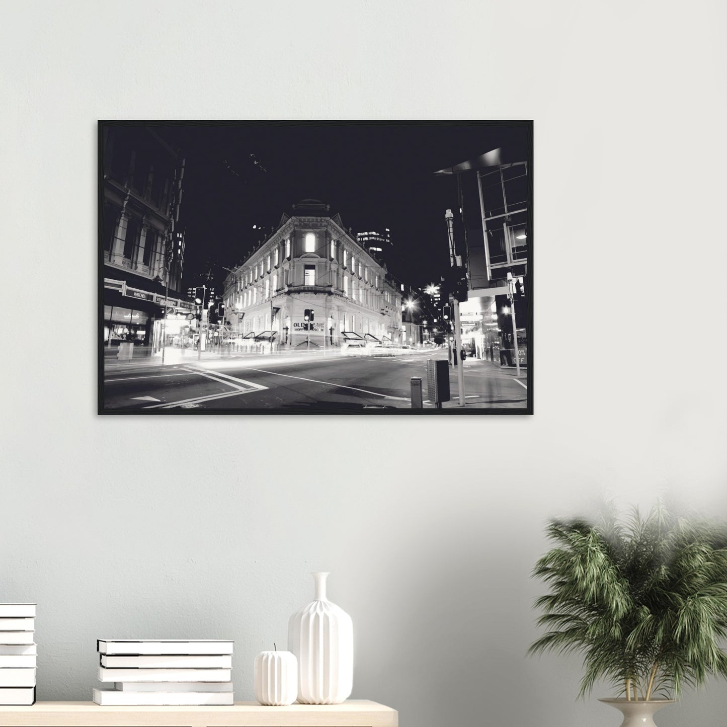 Monochrome artwork of Wellington’s Old Bank Arcade lit up at night, with glowing windows and a classic architectural facade.