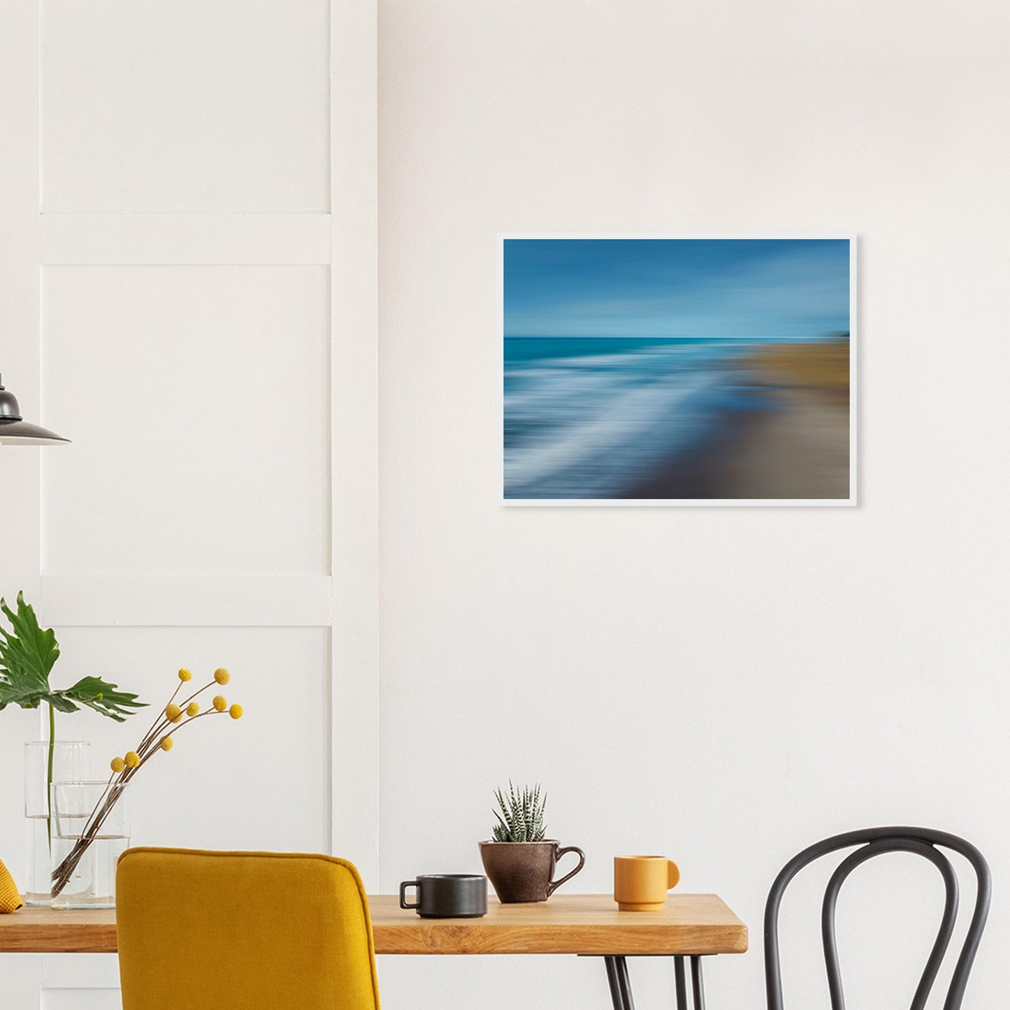 ‘Ocean breeze’ captures the movement of waves and shoreline in a beautifully blurred perspective, creating a dreamlike seascape of blues, teals, and sandy browns.