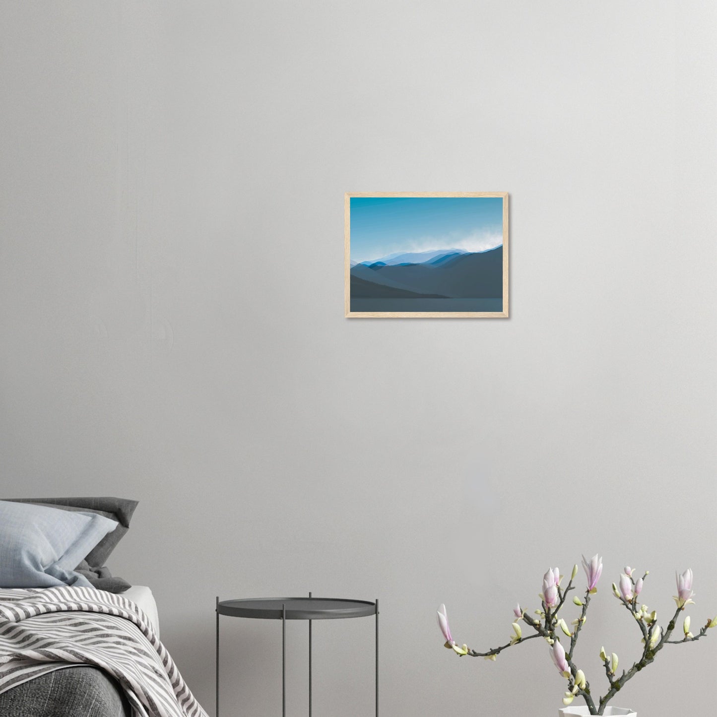 Layered blue mountain ridges fading into mist under a soft sky, evoking calm and simplicity.