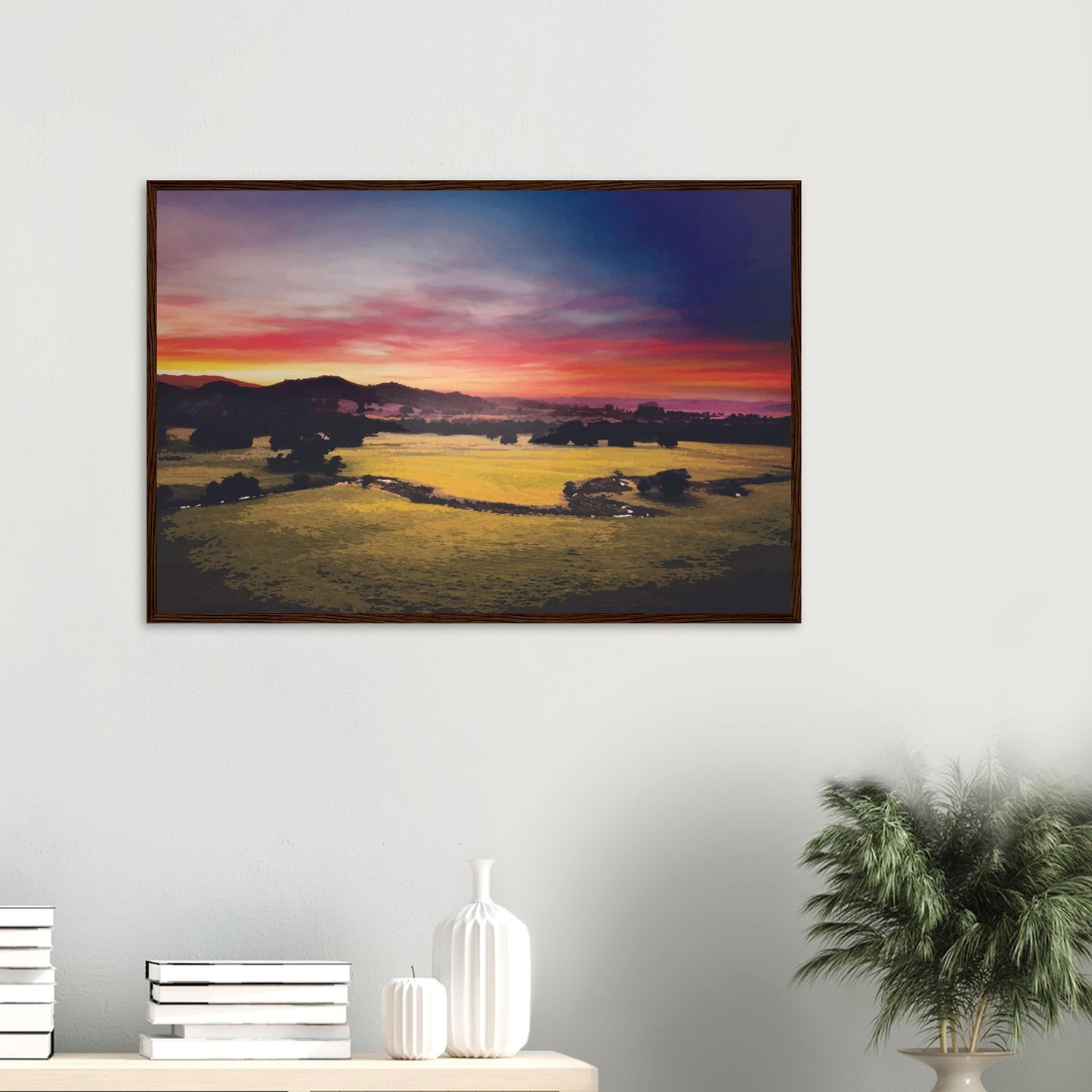 Sunrise over green fields and hills in Wairarapa, with glowing skies in purple, orange, and pink.