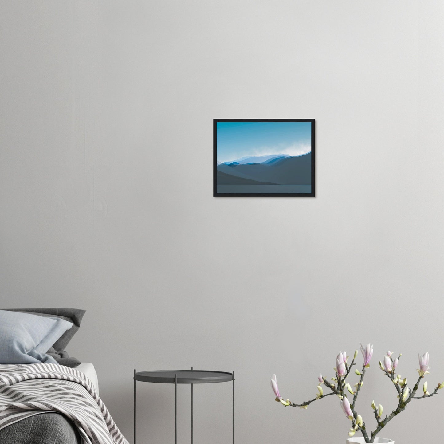 Layered blue mountain ridges fading into mist under a soft sky, evoking calm and simplicity.