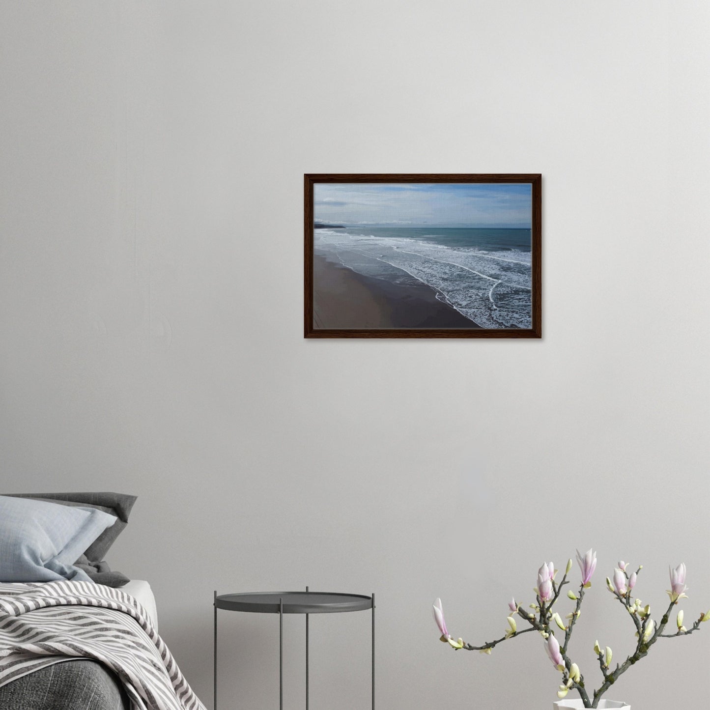 Soft, muted tones of sand, seafoam, and sky blend together in a calming composition, highlighting the natural rhythm of waves lapping the shore.