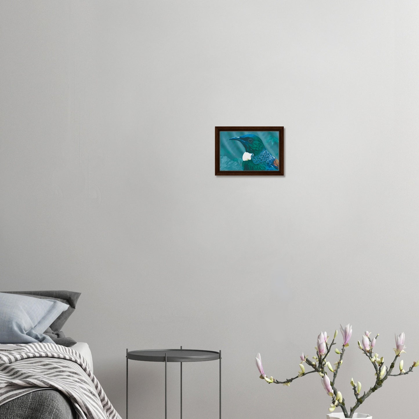 With rich teal and emerald hues and the tūī’s signature white throat tufts, the artwork evokes the dappled light of the forest and the bird’s melodic presence among the trees.