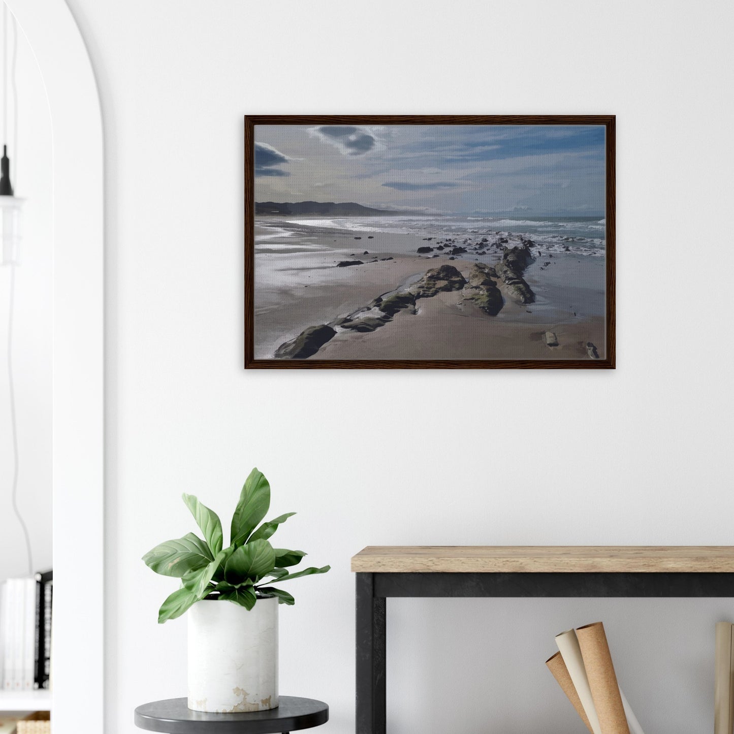A moody, windswept beach and a line of sea-weathered rocks stretching into the distance, this artwork captures the raw, untouched feel of a wild shoreline.