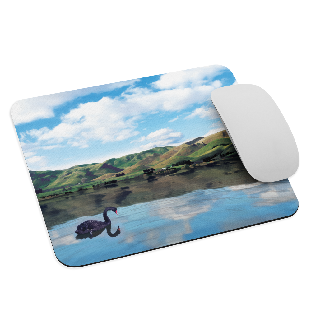 Mouse pad with a black swan on a calm lake, New Zealand hills in the background. Art by NZ designer Ben Hart.