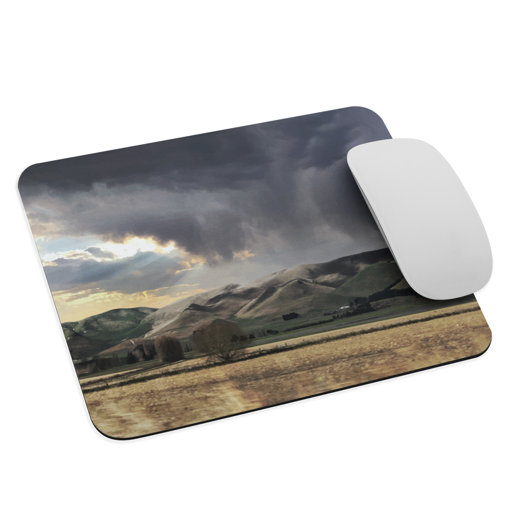 Designer mouse pad with NZ landscape painting of Te Hauke and cloudy skies by Ben Hart.
