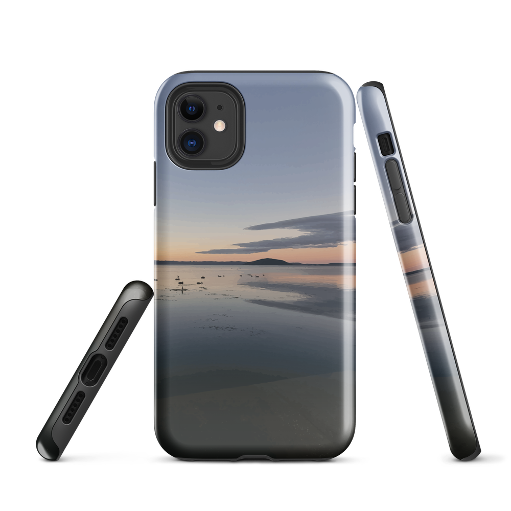 Phone case with tranquil lake scene at sunrise and distant hills.