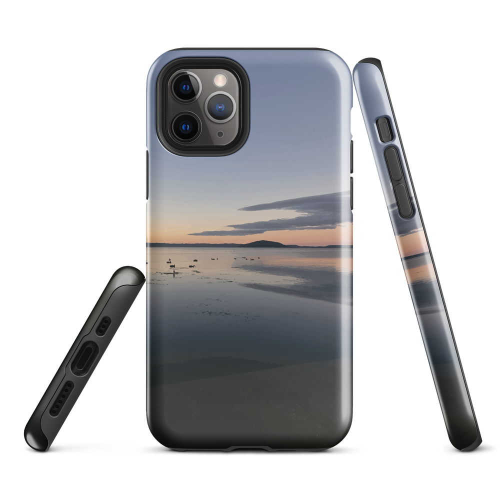Phone case with tranquil lake scene at sunrise and distant hills.