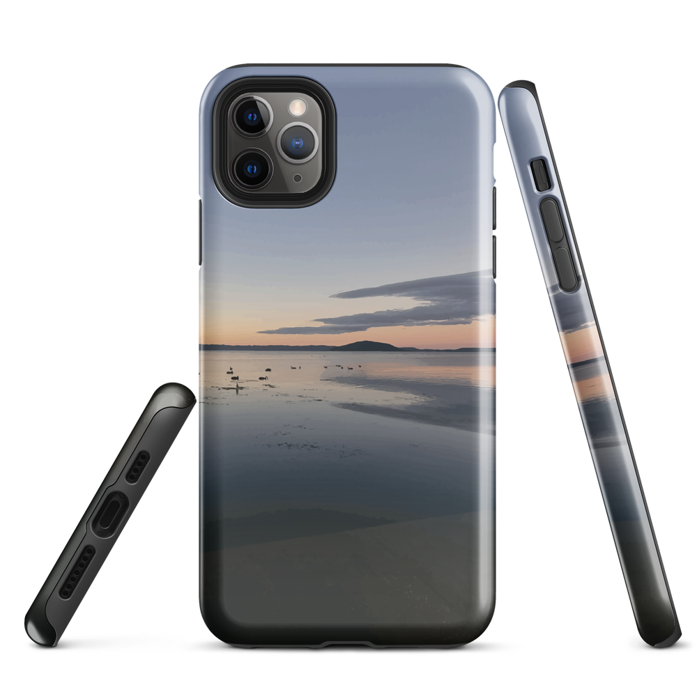 Phone case with tranquil lake scene at sunrise and distant hills.