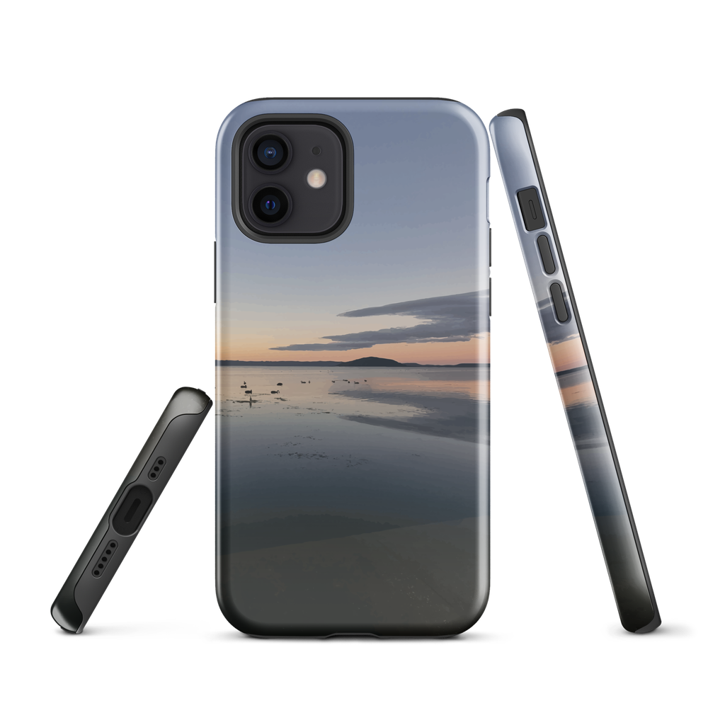 Phone case with tranquil lake scene at sunrise and distant hills.
