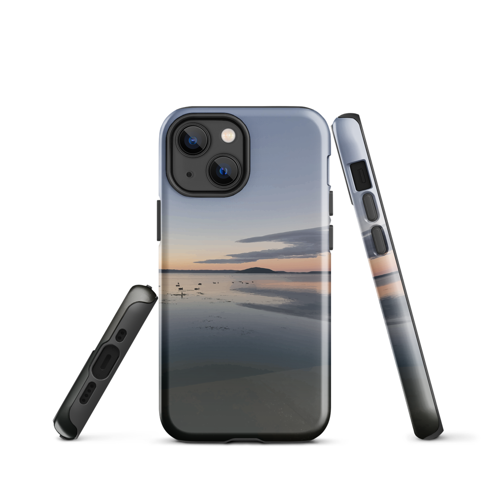 Phone case with tranquil lake scene at sunrise and distant hills.