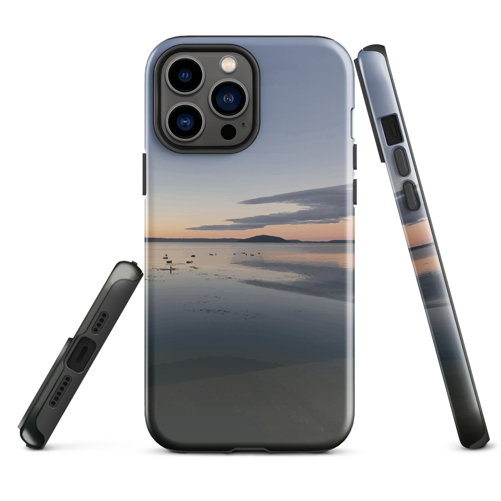 Phone case with tranquil lake scene at sunrise and distant hills.
