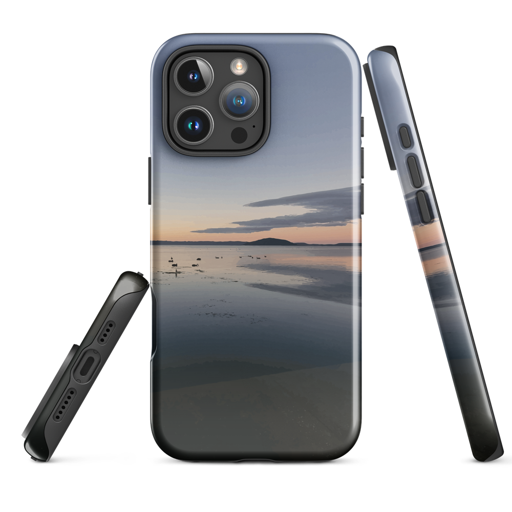 Phone case with tranquil lake scene at sunrise and distant hills.