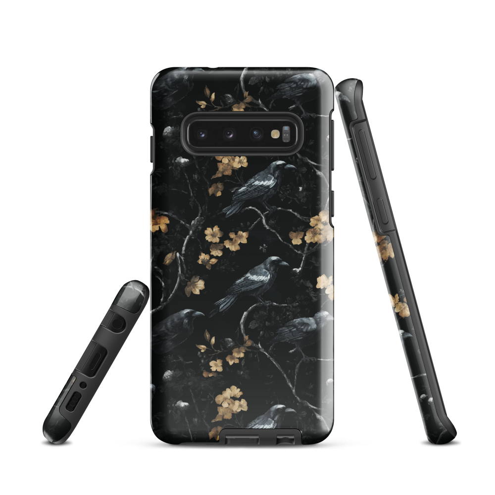 Dark phone case with blackbirds and gold blossoms on black branches.