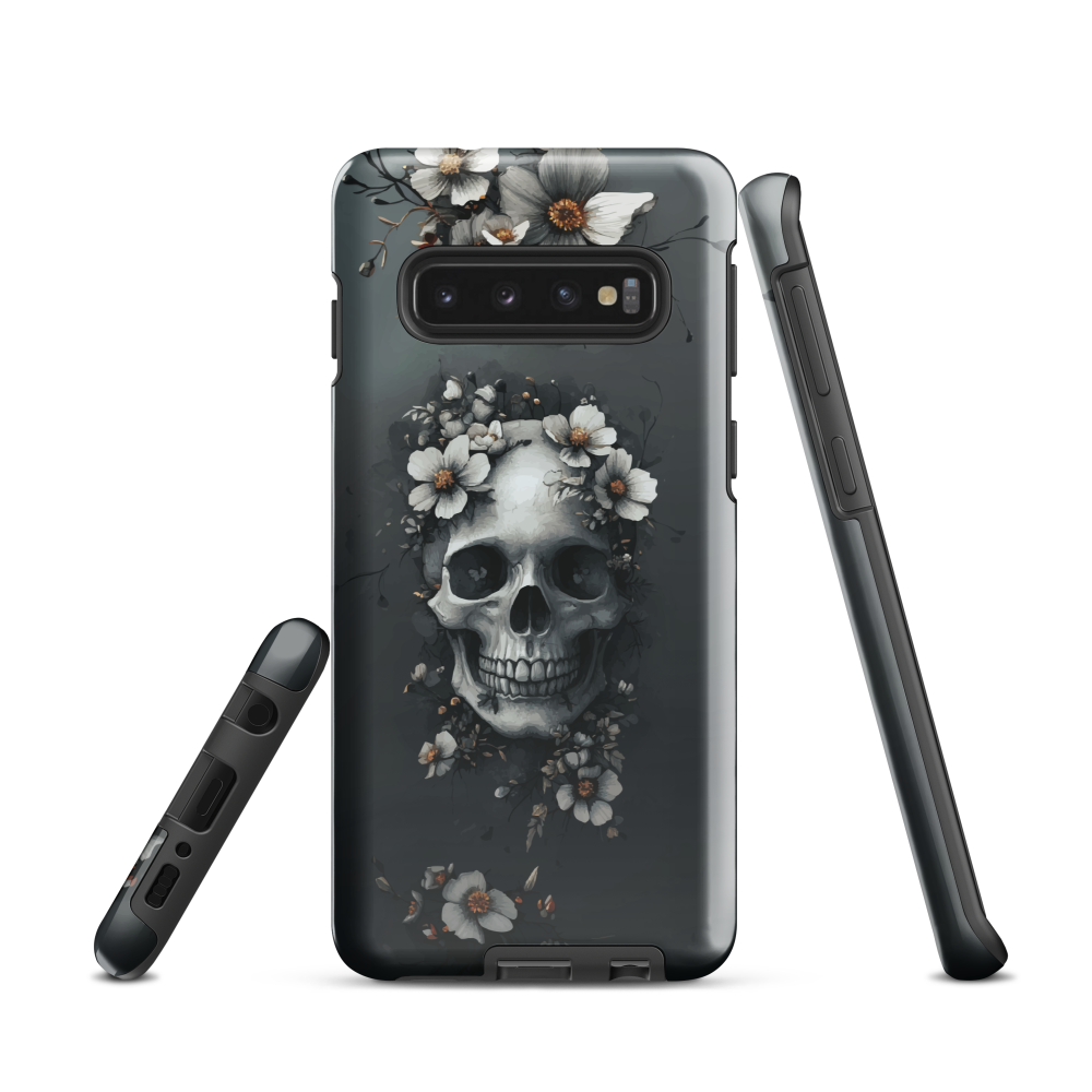 Gothic phone case with a floral skull design in grey tones, featuring white blossoms and dark detailing.