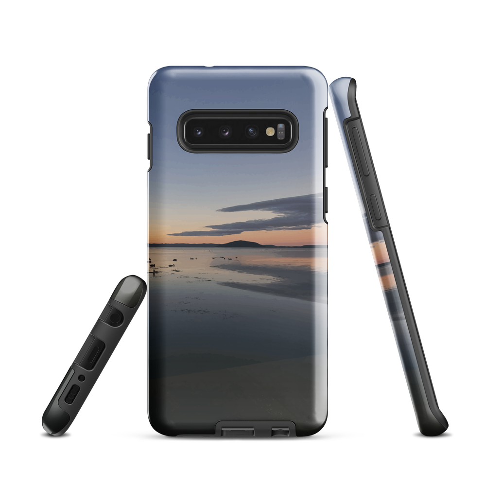 Phone case with tranquil lake scene at sunrise and distant hills.
