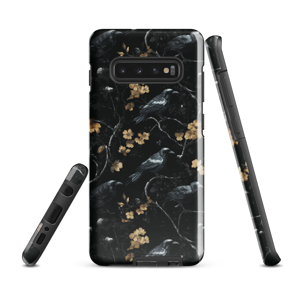 Dark phone case with blackbirds and gold blossoms on black branches.