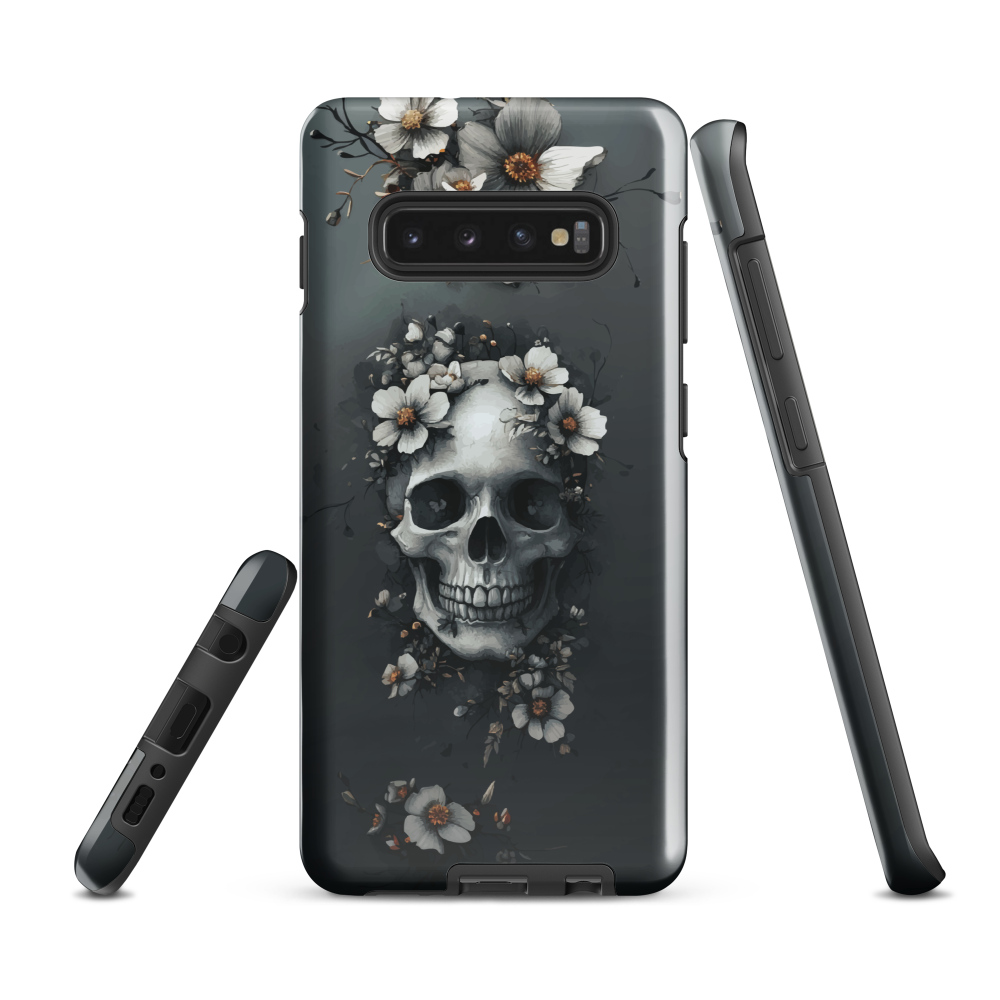 Gothic phone case with a floral skull design in grey tones, featuring white blossoms and dark detailing.