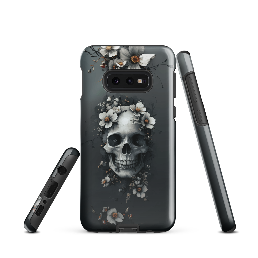 Gothic phone case with a floral skull design in grey tones, featuring white blossoms and dark detailing.