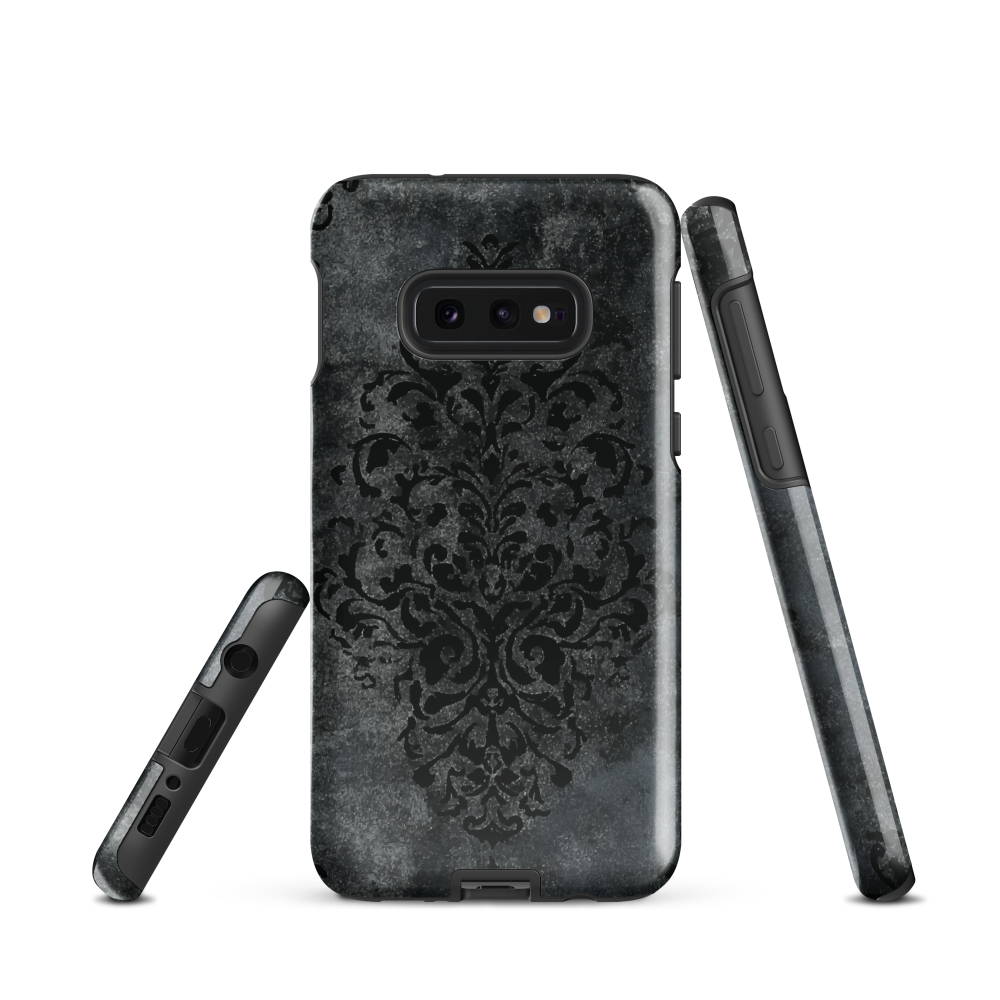 Dark damask patterned phone case with a vintage gothic aesthetic and textured stone background.