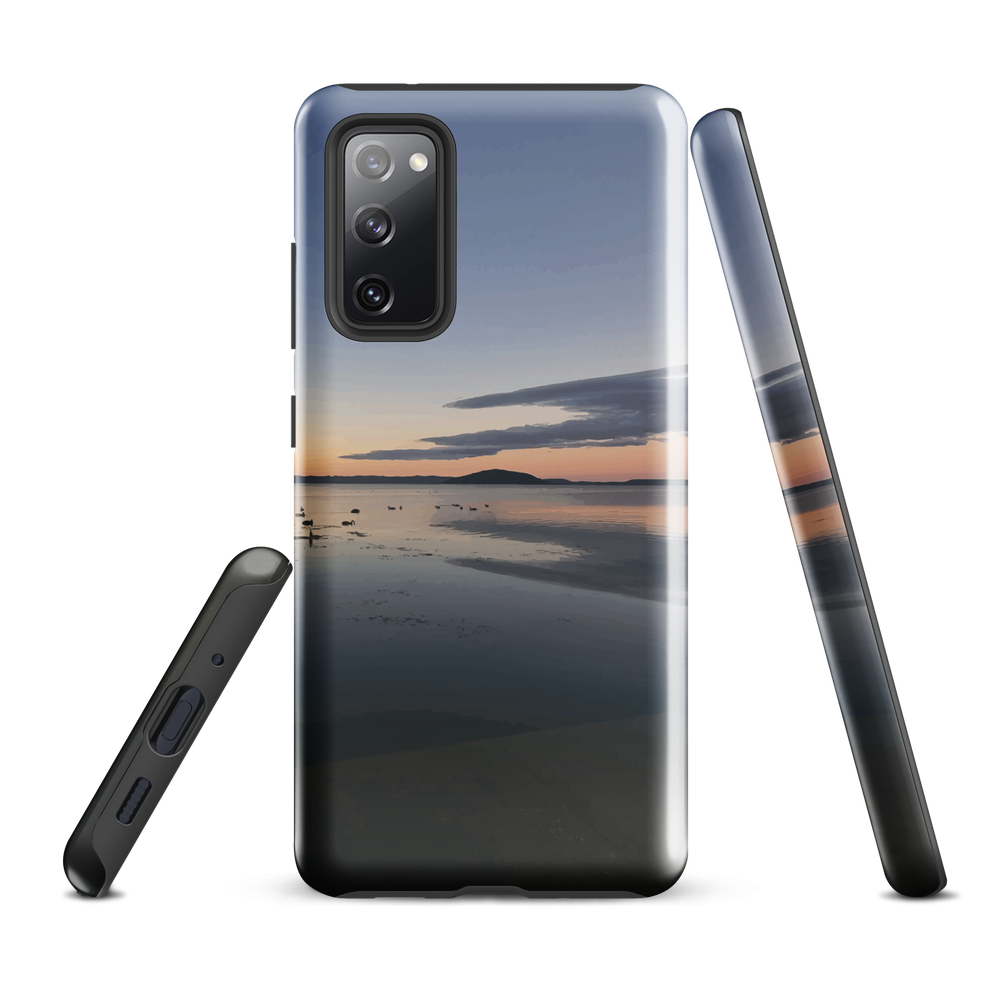 Phone case with tranquil lake scene at sunrise and distant hills.