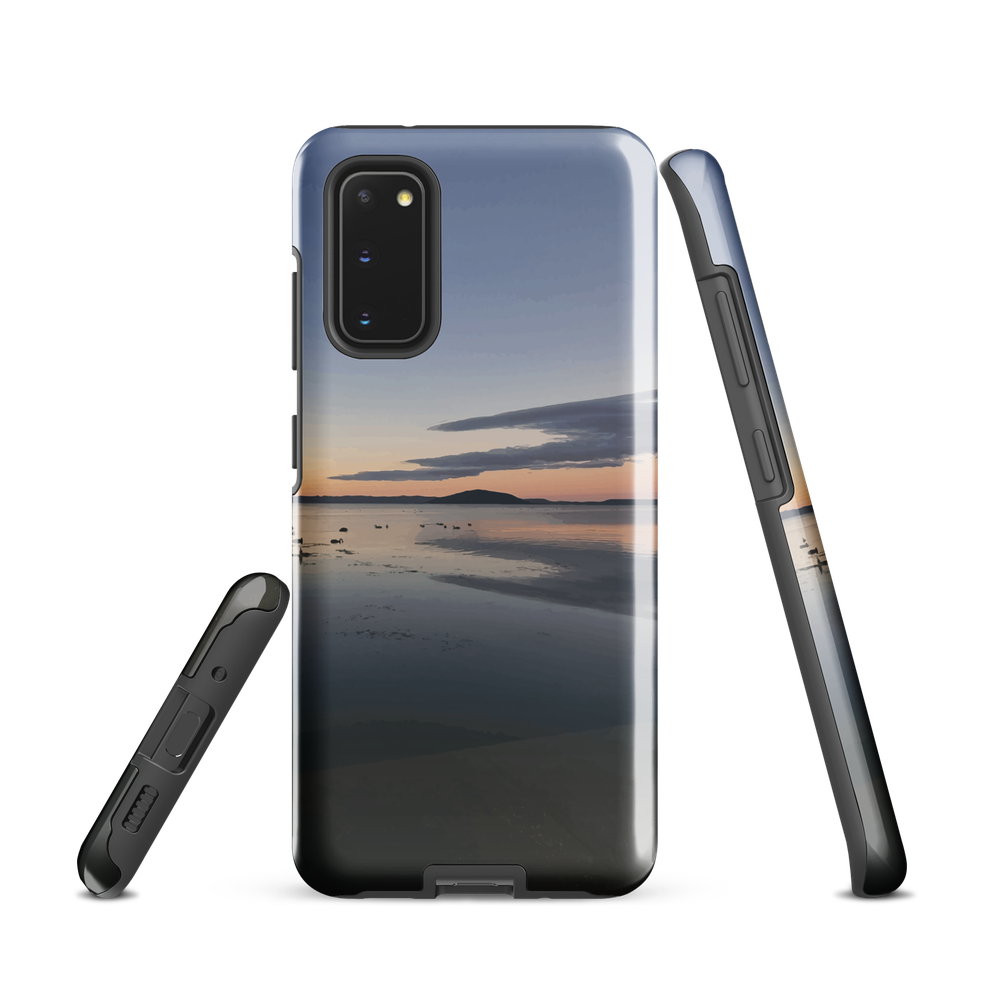 Phone case with tranquil lake scene at sunrise and distant hills.