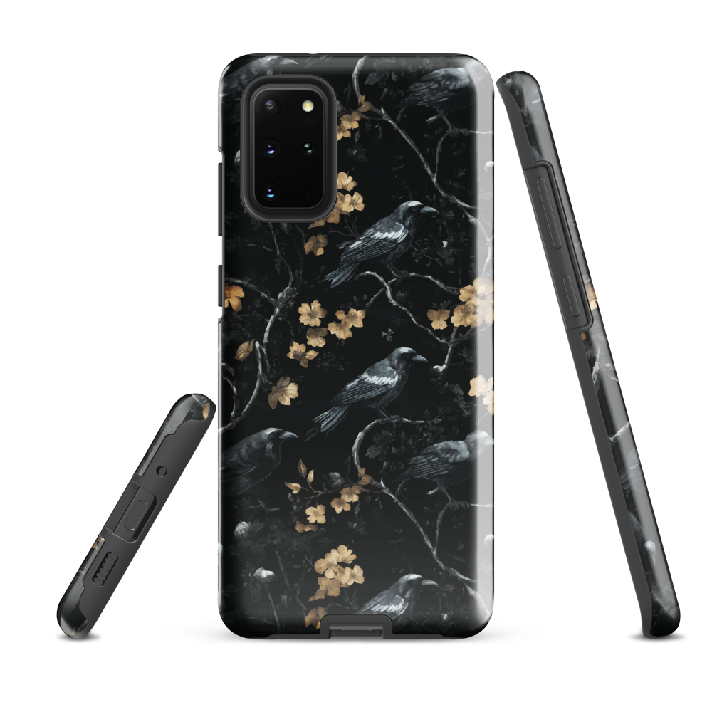Dark phone case with blackbirds and gold blossoms on black branches.