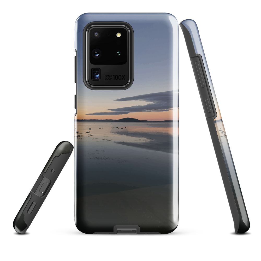 Phone case with tranquil lake scene at sunrise and distant hills.
