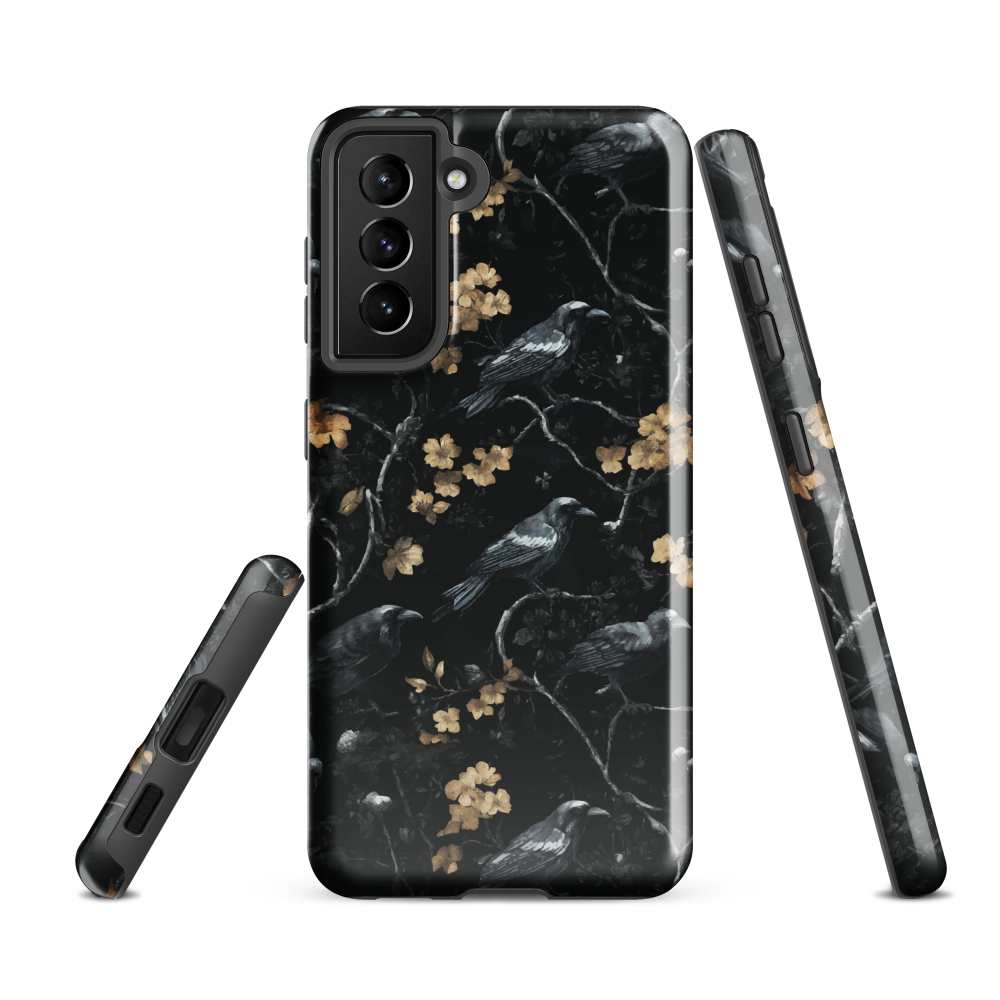 Dark phone case with blackbirds and gold blossoms on black branches.
