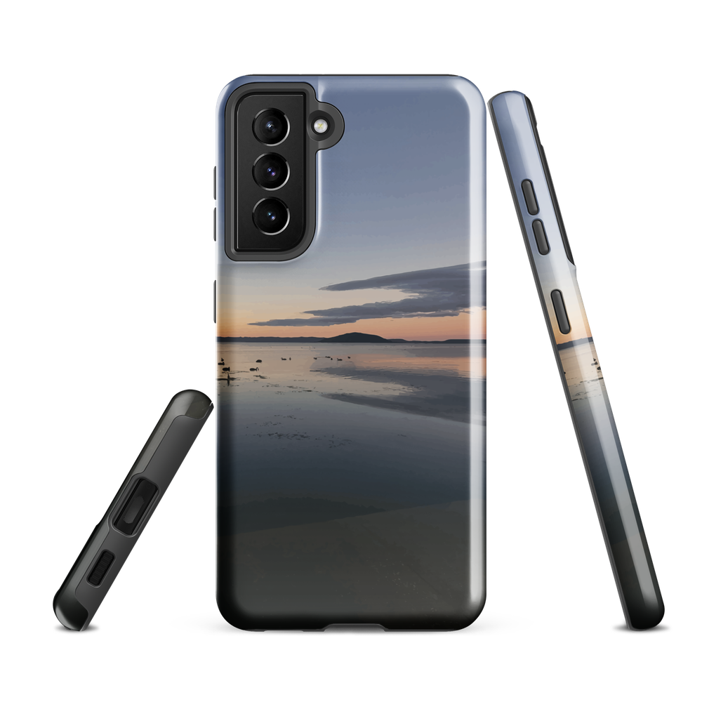 Phone case with tranquil lake scene at sunrise and distant hills.