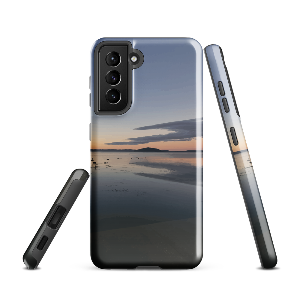 Phone case with tranquil lake scene at sunrise and distant hills.