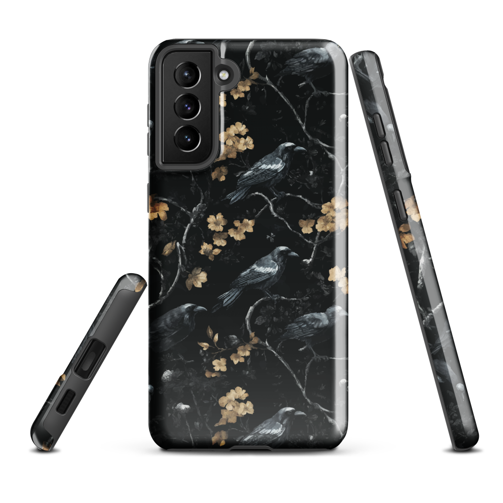 Dark phone case with blackbirds and gold blossoms on black branches.