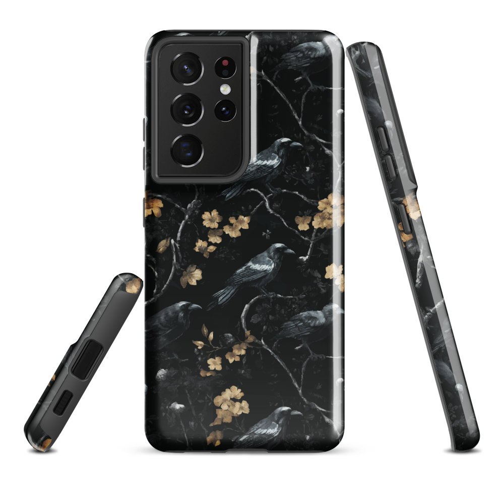Dark phone case with blackbirds and gold blossoms on black branches.