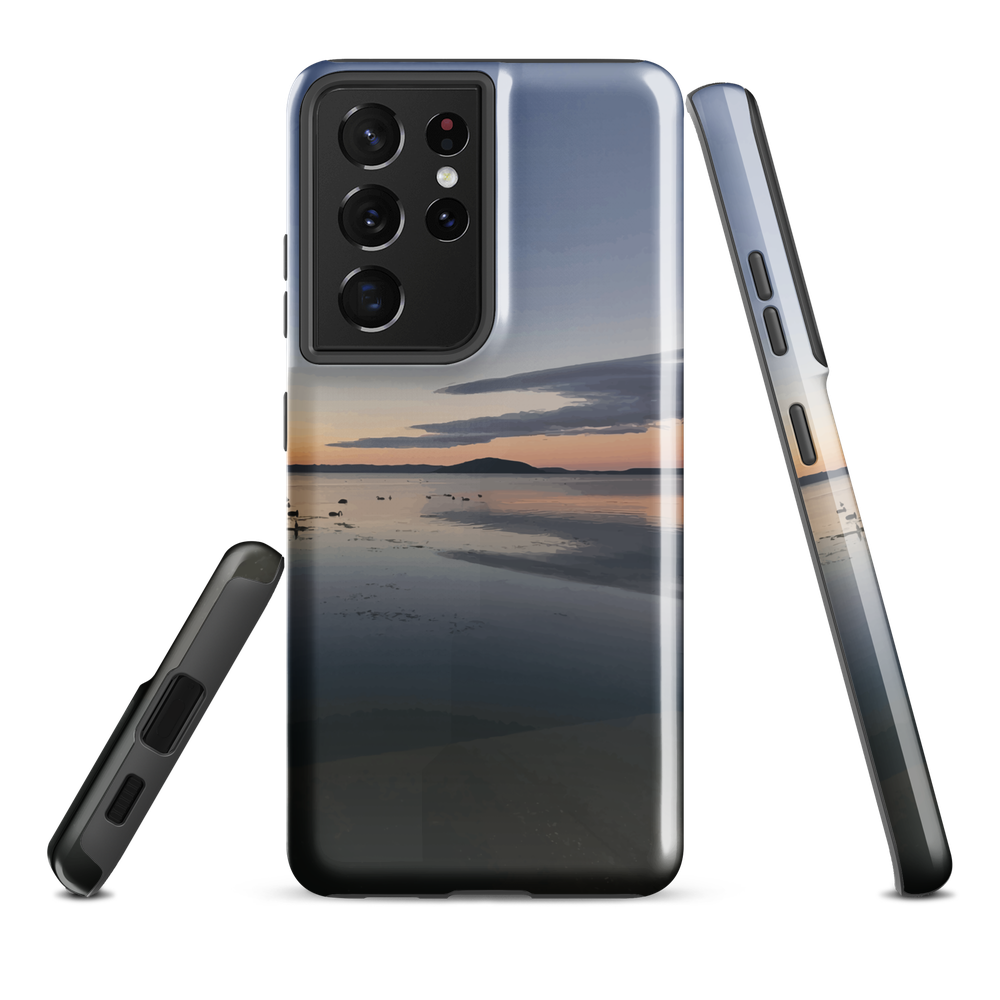 Phone case with tranquil lake scene at sunrise and distant hills.