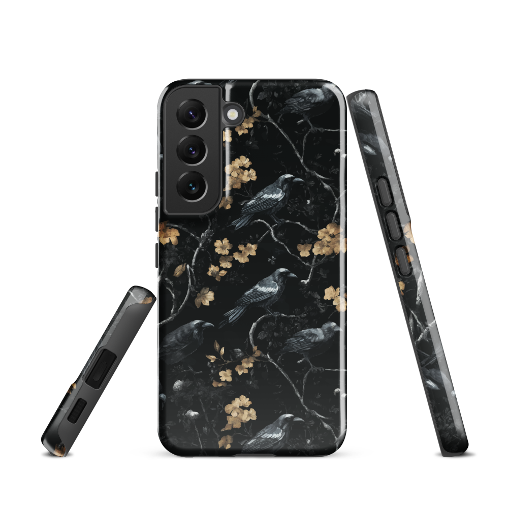 Dark phone case with blackbirds and gold blossoms on black branches.